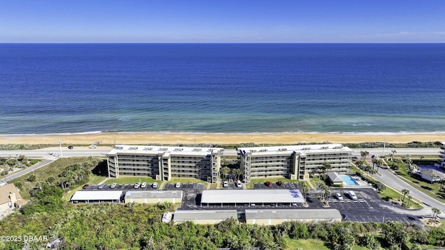 bird's eye view with a water view and a view of the beach