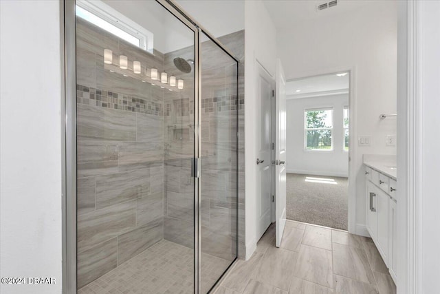 bathroom with vanity and an enclosed shower