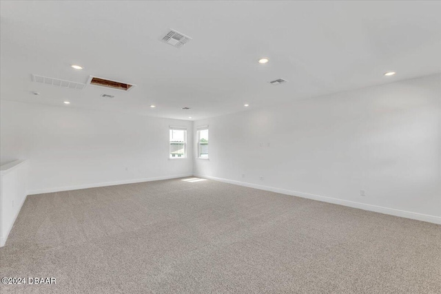 empty room with light colored carpet