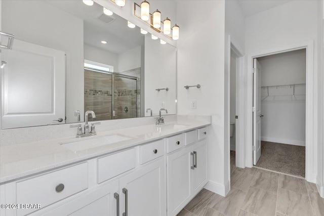 bathroom featuring vanity and walk in shower