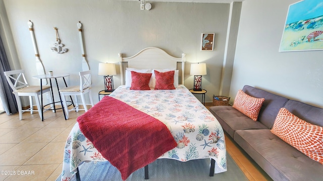 bedroom featuring light tile patterned floors