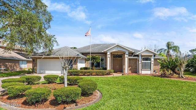 ranch-style home with driveway, a front lawn, and an attached garage