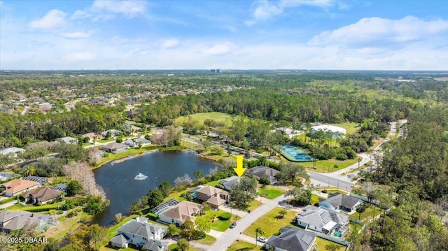 bird's eye view with a water view, a wooded view, and a residential view