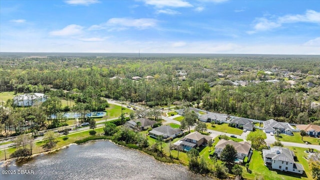 birds eye view of property with a water view, a residential view, and a wooded view