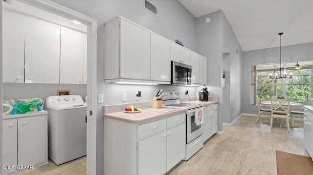 kitchen with white range with electric cooktop, white cabinetry, light countertops, stainless steel microwave, and washer / dryer