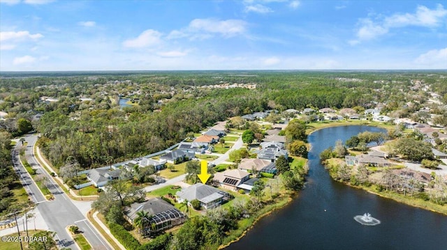 bird's eye view with a water view, a residential view, and a view of trees