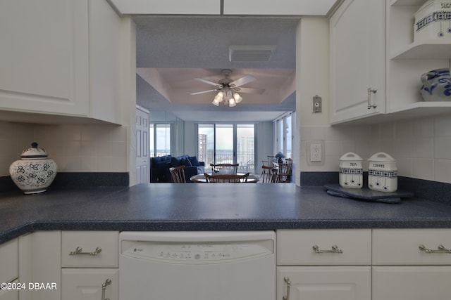 3047 S Atlantic Ave Unit 1206, Daytona Beach, FL 32118 - kitchen featuring white cabinets, ceiling fan, white dishwasher, and backsplash