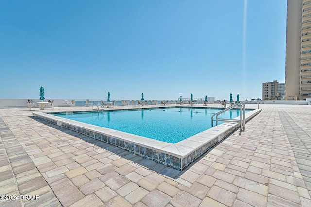 3047 S Atlantic Ave Unit 1206, Daytona Beach, FL 32118 - view of swimming pool with a patio