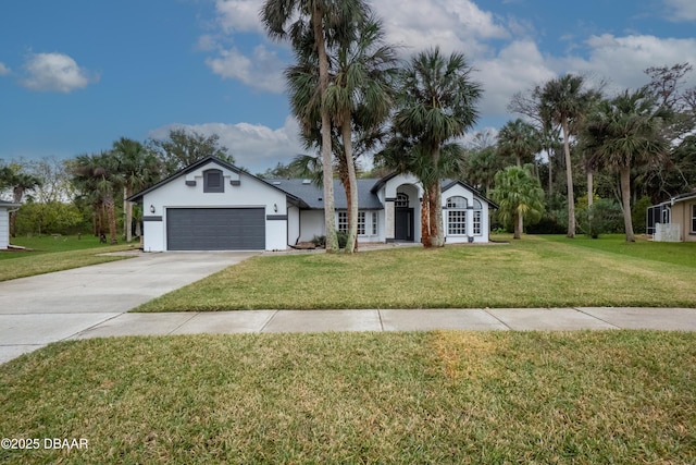 view of front of property featuring a garage and a front lawn