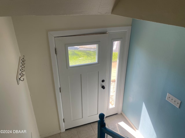 entryway featuring light tile patterned floors