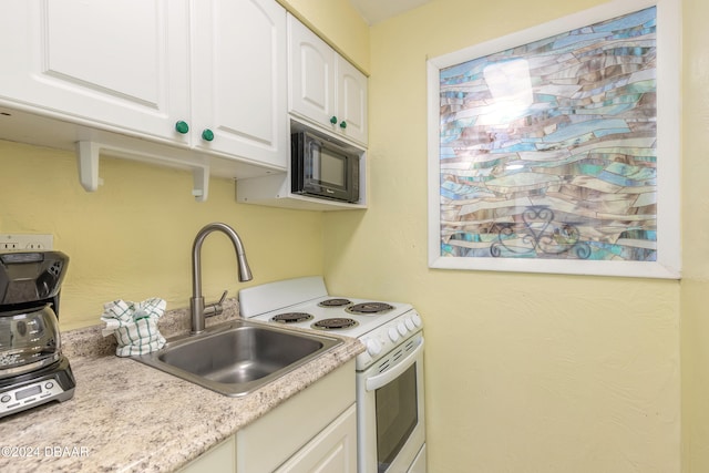 kitchen with white cabinetry, sink, and white electric stove