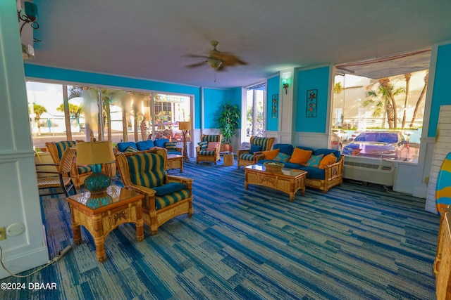 313 S Atlantic Avenue 501 & 503, Daytona Beach, FL 32118 - carpeted living room with ceiling fan and wainscoting