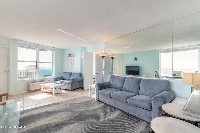 313 S Atlantic Avenue 501 & 503, Daytona Beach, FL 32118 - living room with light tile patterned flooring and an AC wall unit