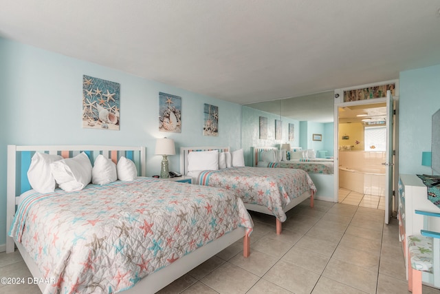 bedroom with tile patterned flooring and ensuite bath