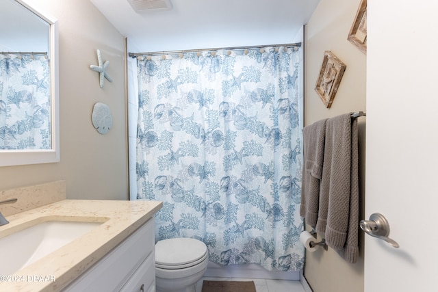 bathroom with a shower with shower curtain, tile patterned flooring, vanity, and toilet