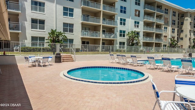 view of pool featuring a patio