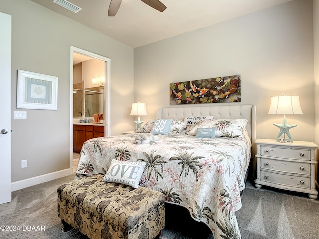 bedroom with ceiling fan, ensuite bath, and carpet