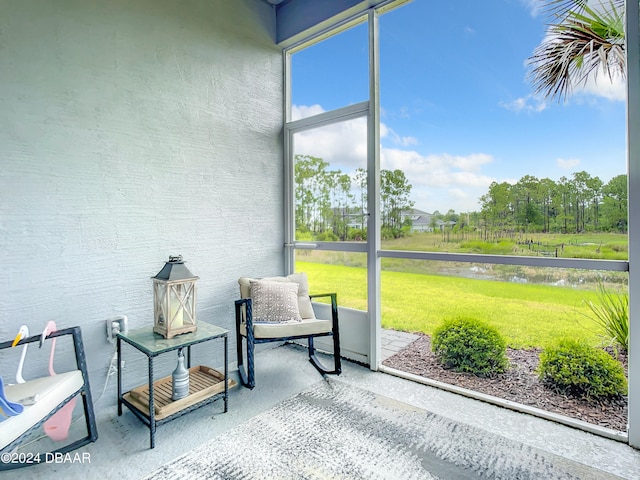 sunroom with a water view