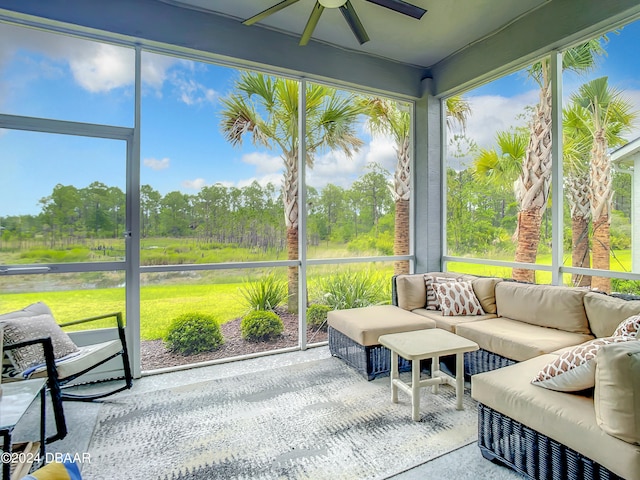 sunroom / solarium with a wealth of natural light and ceiling fan