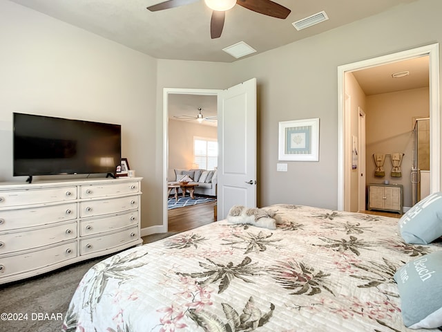 bedroom with ceiling fan and dark hardwood / wood-style floors