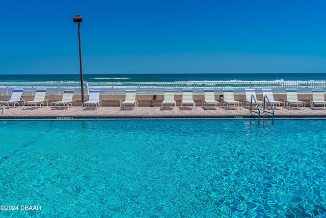313 S Atlantic Ave Unit 602And 604, Daytona Beach, FL 32118 - community pool featuring a water view and a patio