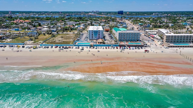 aerial view featuring a water view and a beach view