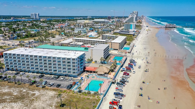 bird's eye view featuring a view of the beach and a water view