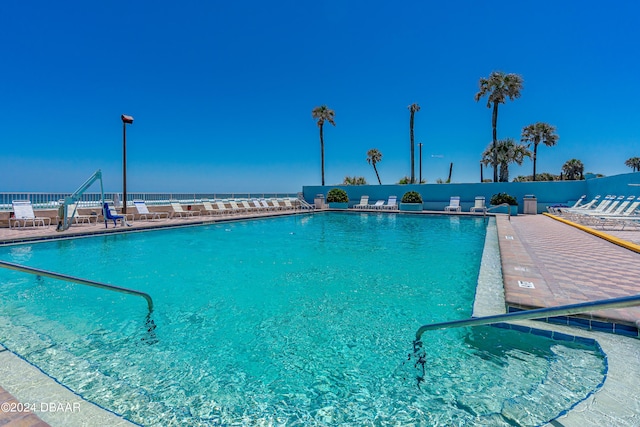 view of pool featuring a water view