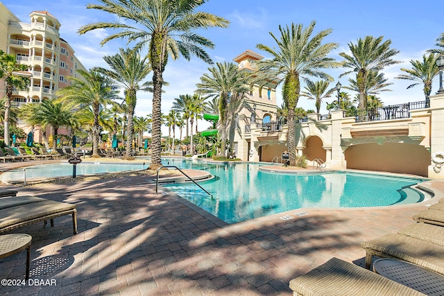 view of swimming pool with a patio