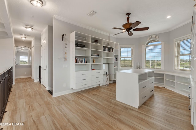 walk in closet featuring ceiling fan and light hardwood / wood-style flooring