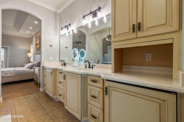 bathroom featuring crown molding, tile patterned flooring, vanity, and ceiling fan