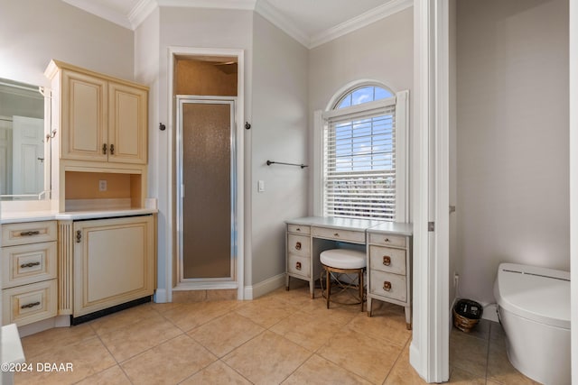 bathroom featuring tile patterned floors, crown molding, toilet, and walk in shower