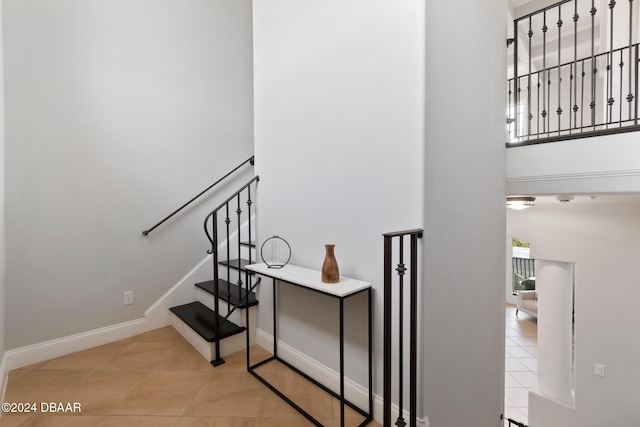 staircase with tile patterned flooring