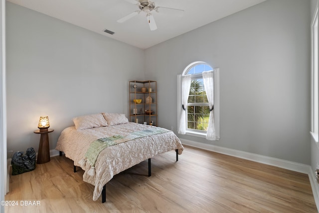 bedroom featuring light hardwood / wood-style flooring and ceiling fan