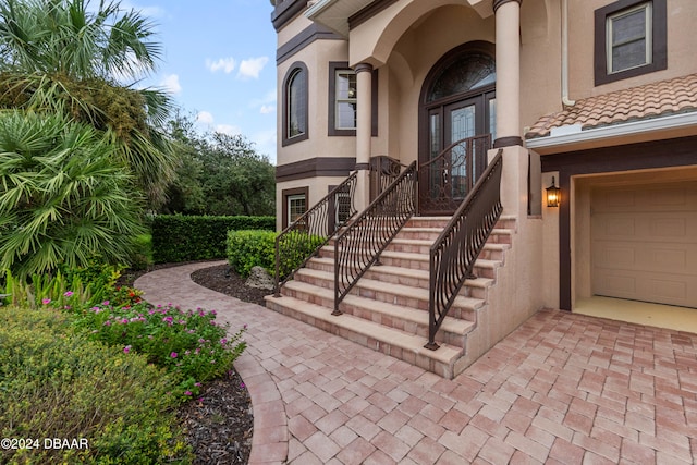 view of exterior entry featuring a garage