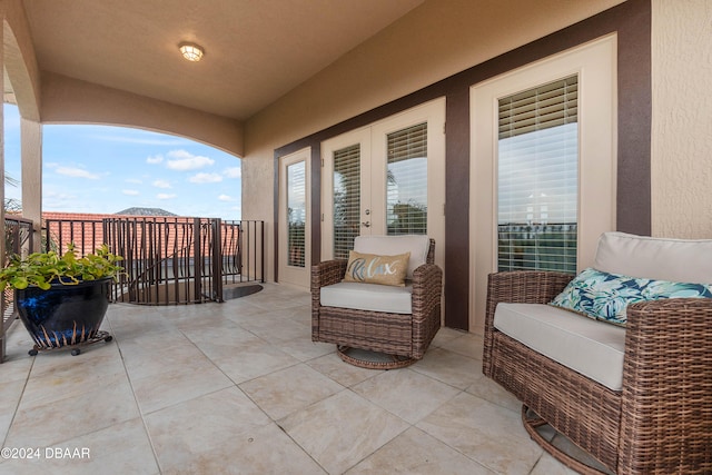 view of patio featuring a balcony