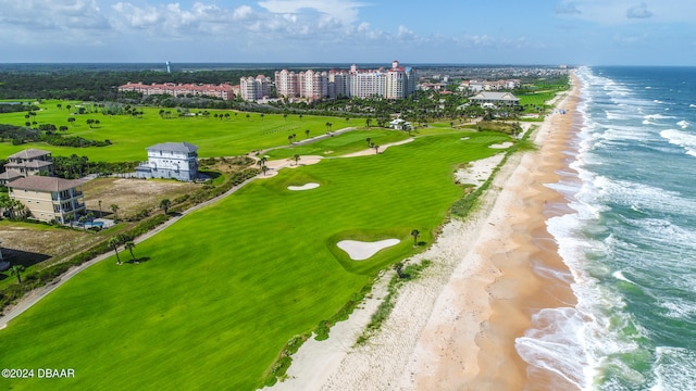 drone / aerial view featuring a water view and a beach view