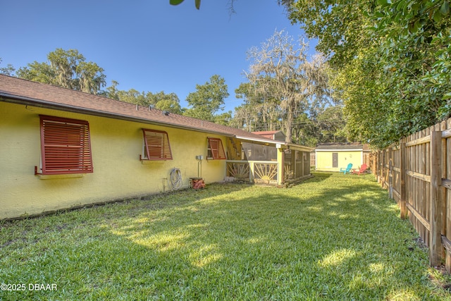 3048 Mango Tree Dr, Edgewater, FL 32141 - view of yard featuring a sunroom, a shed, and an outbuilding