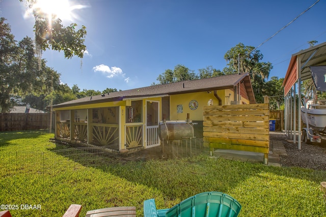 3048 Mango Tree Dr, Edgewater, FL 32141 - rear view of house with a sunroom and roof with shingles