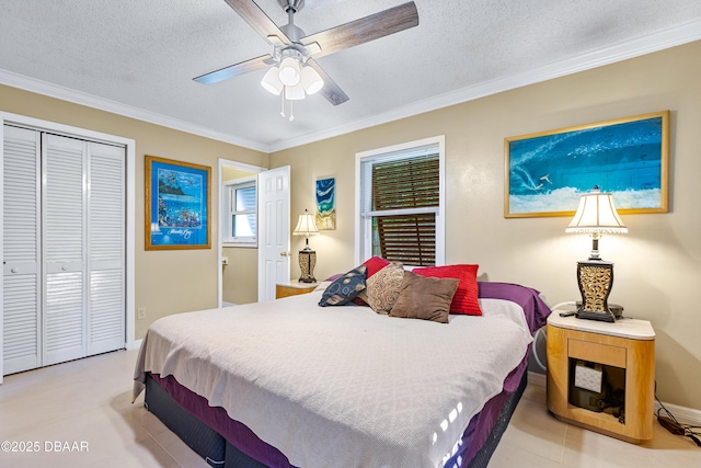 3048 Mango Tree Dr, Edgewater, FL 32141 - bedroom featuring ornamental molding, a textured ceiling, a closet, baseboards, and ceiling fan