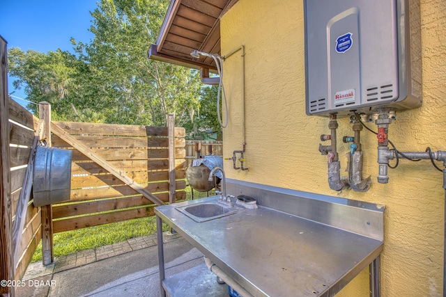 3048 Mango Tree Dr, Edgewater, FL 32141 - view of patio featuring water heater and fence