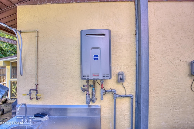 3048 Mango Tree Dr, Edgewater, FL 32141 - exterior view of stucco siding and water heater