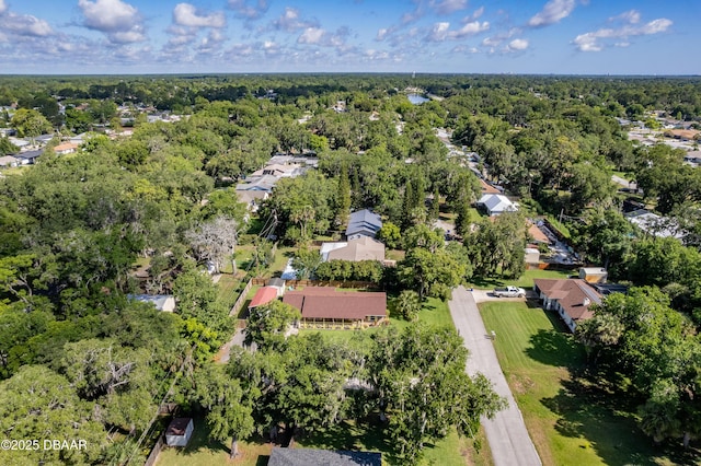 3048 Mango Tree Dr, Edgewater, FL 32141 - aerial view of property and surrounding area featuring a heavily wooded area and nearby suburban area