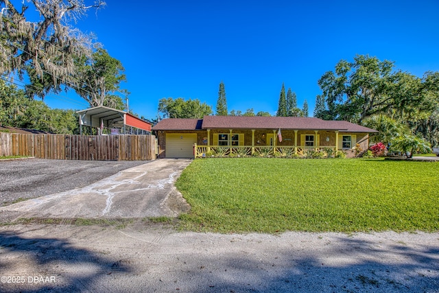 3048 Mango Tree Dr, Edgewater, FL 32141 - single story home with covered porch, an attached garage, driveway, and a carport