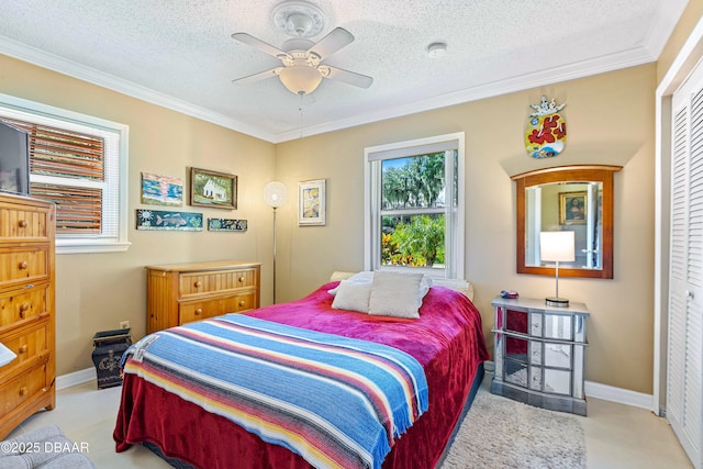 3048 Mango Tree Dr, Edgewater, FL 32141 - bedroom featuring crown molding, baseboards, a textured ceiling, and ceiling fan