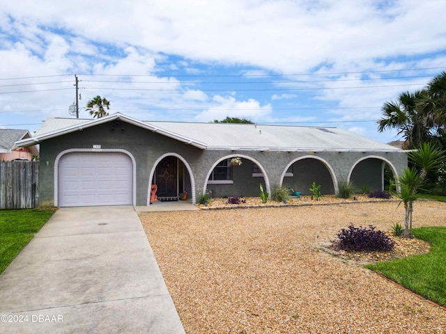 single story home featuring a garage