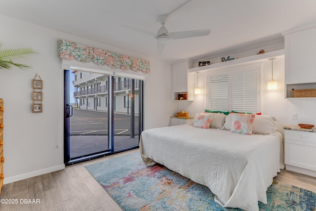 bedroom featuring light wood-type flooring, access to exterior, and ceiling fan