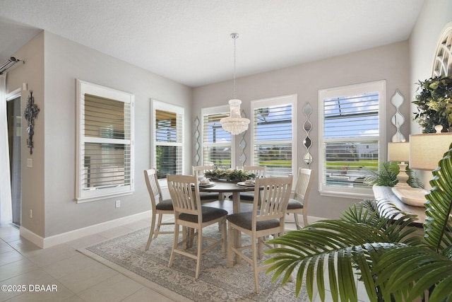 6279 W Fallsgrove Ln, Port Orange, FL 32128 - dining room with a chandelier and light tile patterned floors