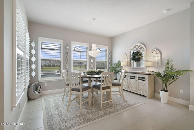 6279 W Fallsgrove Ln, Port Orange, FL 32128 - dining area with baseboards and light tile patterned flooring