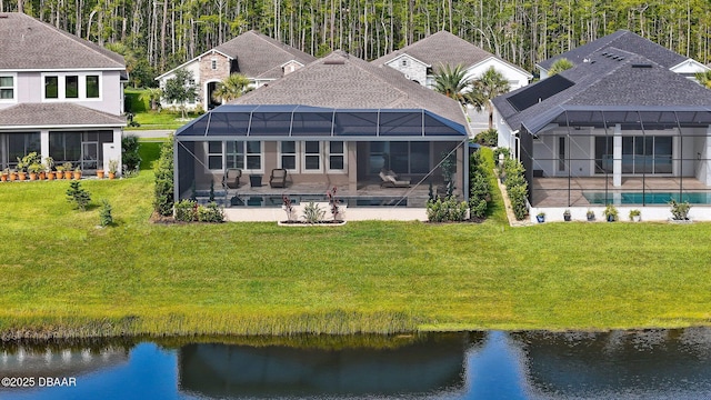 6279 W Fallsgrove Ln, Port Orange, FL 32128 - rear view of house with an outdoor pool, a yard, and a water view